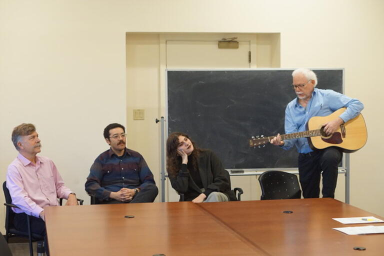Visiting Professor John McDowell performing a corrido during a podcast interview with (left to right) Charles Briggs and graduate students Cameron Johnson and Leah Simon 